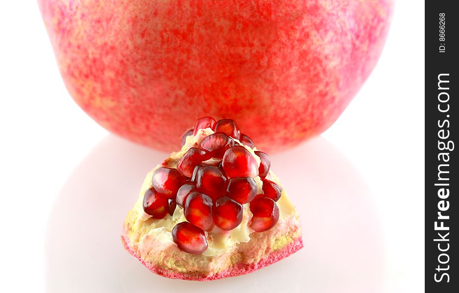 Piece of pomegranate isolated on white