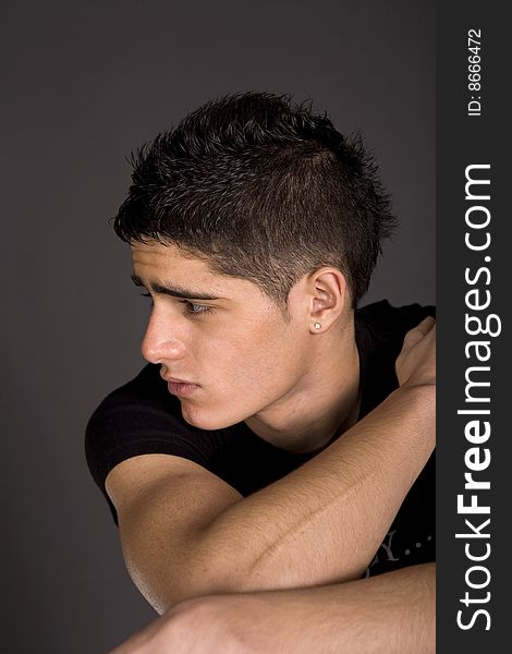 Fashion portrait of teenager over grey background