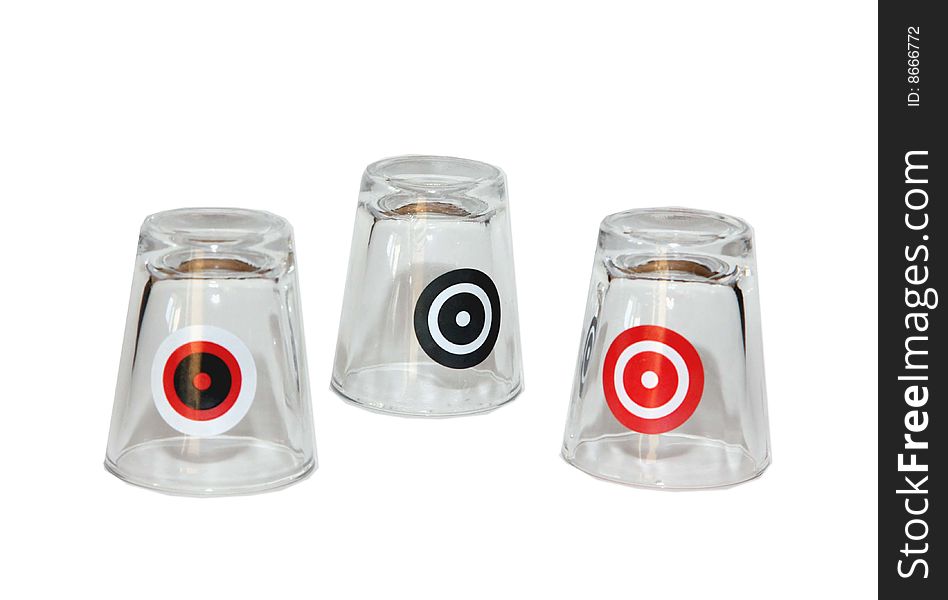 Three shot glasses with targets on them