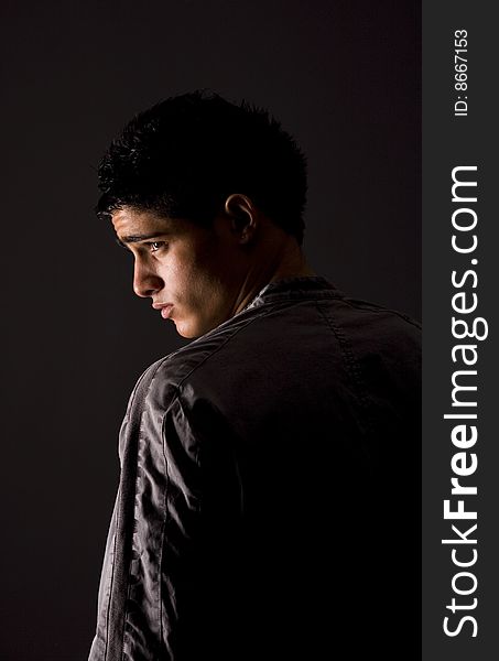 Fashion portrait of teenager over grey background