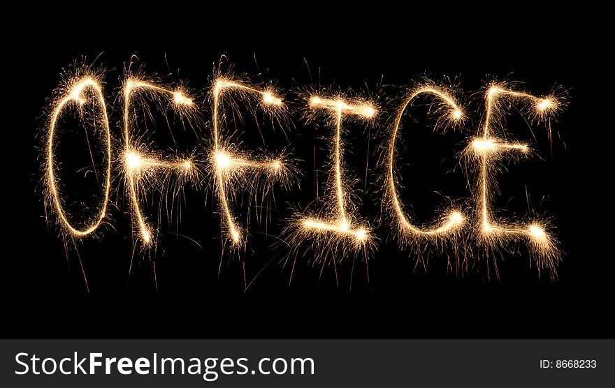 Word office written sparkler on dark