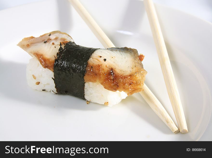 The Japanese meal with rice a fish and sea seaweed.