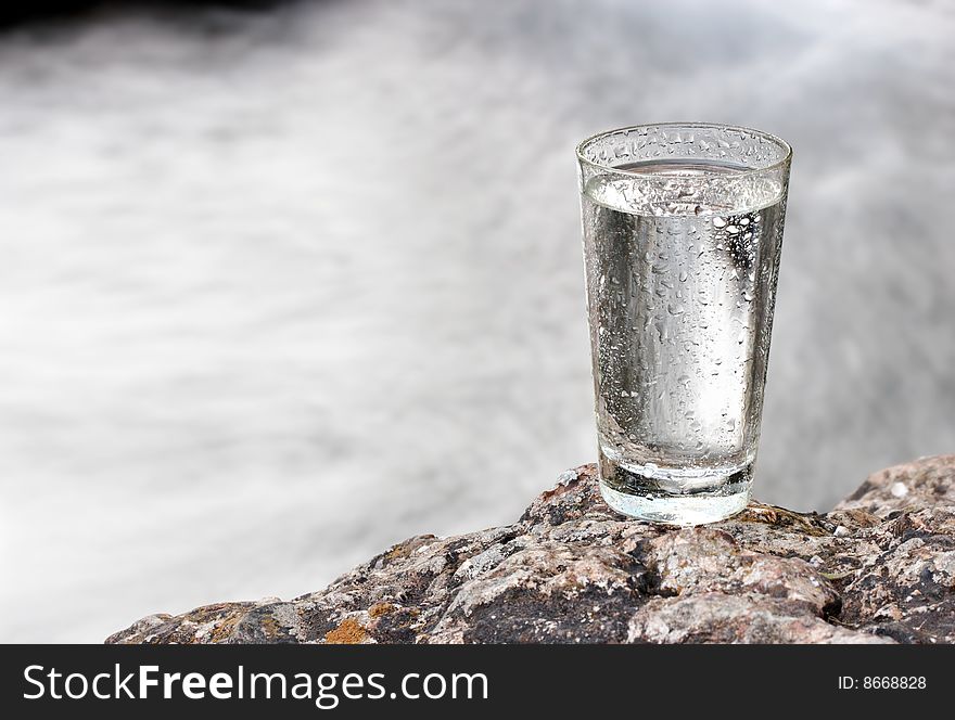 One glass of water in nature