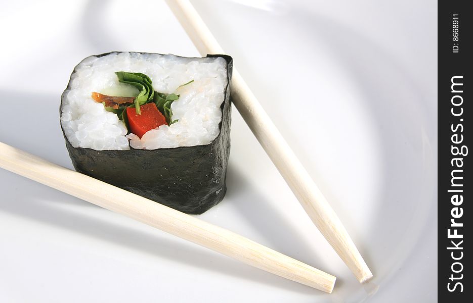 The Japanese meal with rice a fish and sea seaweed.