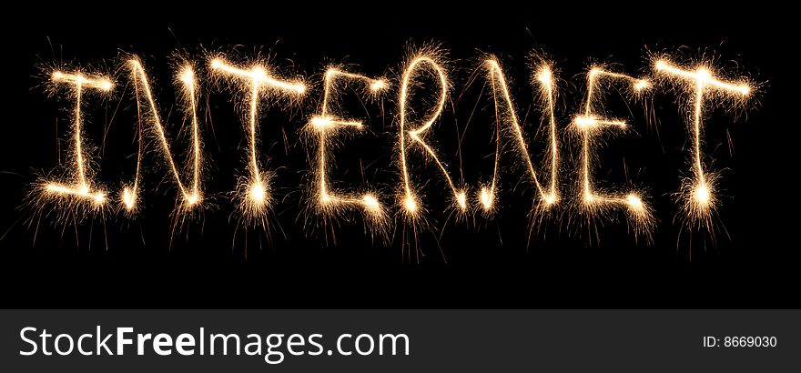 Word internet written sparkler on dark