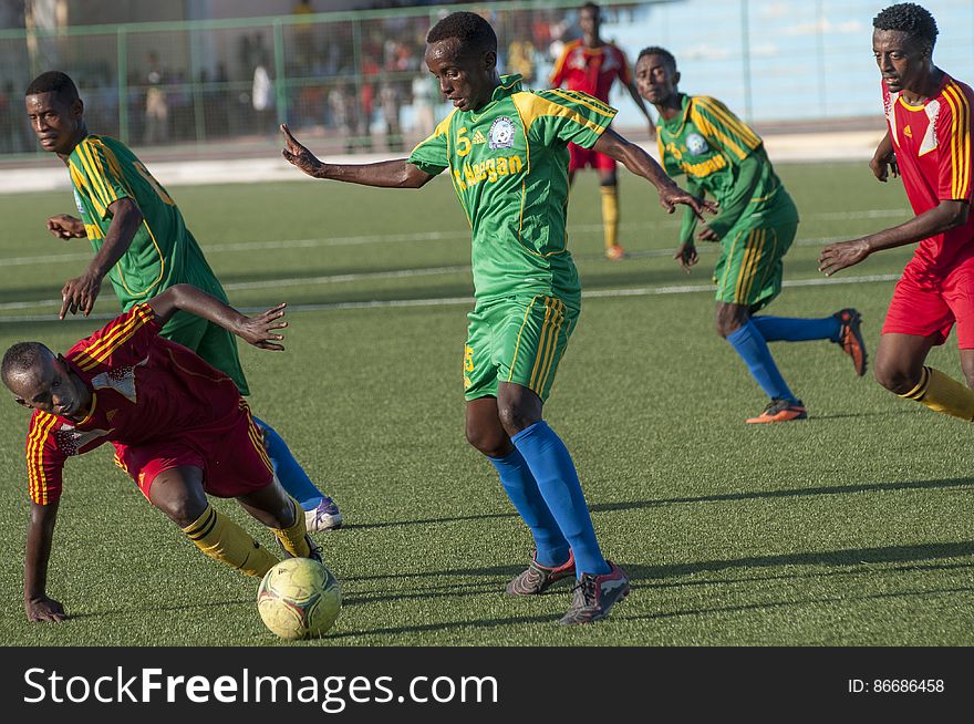A Horseed player stumbles as a Heegan player tries to steal the ball during a game between Heegan and Horseed football clubs at Banadir Stadium on 31st January 2014. AU UN IST PHOTO / David Mutua. A Horseed player stumbles as a Heegan player tries to steal the ball during a game between Heegan and Horseed football clubs at Banadir Stadium on 31st January 2014. AU UN IST PHOTO / David Mutua