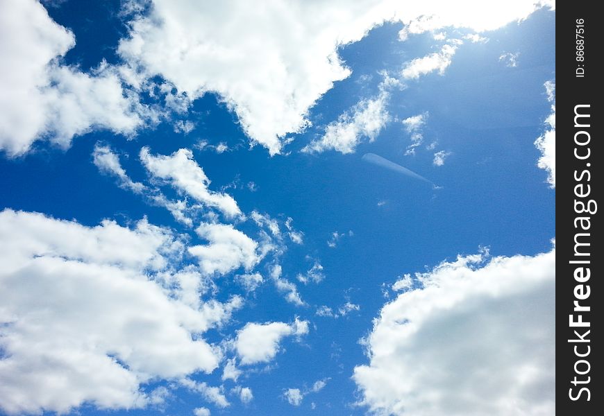 Blue Sky With Puffy White Clouds