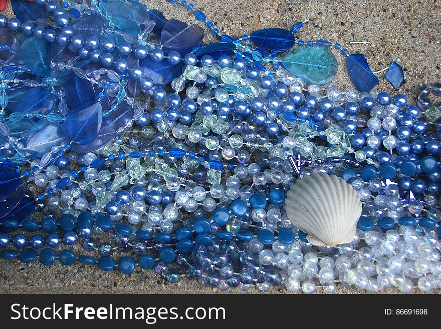 blue beads and glass with shell