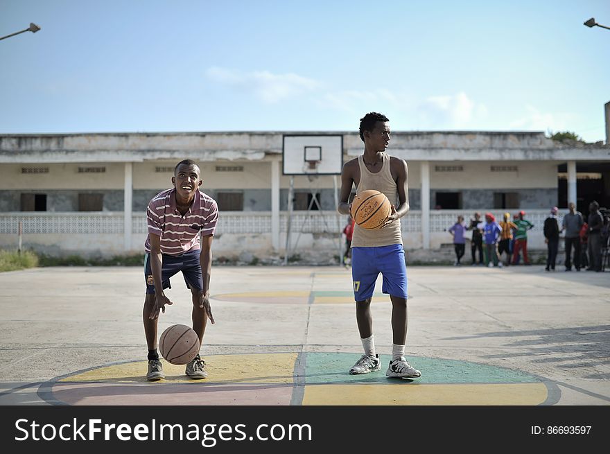 Two boys practice their shooting on a basketball court in Mogadishu, Somalia, on June 6. Banned under the extremist group, Al Shabaab, Basketball is once again making a resurgence in Mogadishu. Today at least a dozen teams in the city already play in a league and both men and women are coming out to play the sport. AU UN IST PHOTO / TOBIN JONES. Two boys practice their shooting on a basketball court in Mogadishu, Somalia, on June 6. Banned under the extremist group, Al Shabaab, Basketball is once again making a resurgence in Mogadishu. Today at least a dozen teams in the city already play in a league and both men and women are coming out to play the sport. AU UN IST PHOTO / TOBIN JONES