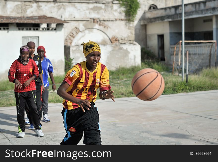 A girl passes a ball during a drill at basketball training session in Mogadishu, Somalia, on June 6. Banned under the extremist group, Al Shabaab, Basketball is once again making a resurgence in Mogadishu. Today at least a dozen teams in the city play in a league and both men and women are coming out to play the sport. AU UN IST PHOTO / TOBIN JONES. A girl passes a ball during a drill at basketball training session in Mogadishu, Somalia, on June 6. Banned under the extremist group, Al Shabaab, Basketball is once again making a resurgence in Mogadishu. Today at least a dozen teams in the city play in a league and both men and women are coming out to play the sport. AU UN IST PHOTO / TOBIN JONES