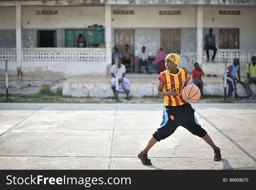 A girl dribbles a ball during basketball practice in Mogadishu, Somalia, on June 6. Banned under the extremist group, Al Shabaab, Basketball is once again making a resurgence in Mogadishu. Today at least a dozen teams in the city already play in a league and both men and women are coming out to play the sport. AU UN IST PHOTO / TOBIN JONES. A girl dribbles a ball during basketball practice in Mogadishu, Somalia, on June 6. Banned under the extremist group, Al Shabaab, Basketball is once again making a resurgence in Mogadishu. Today at least a dozen teams in the city already play in a league and both men and women are coming out to play the sport. AU UN IST PHOTO / TOBIN JONES