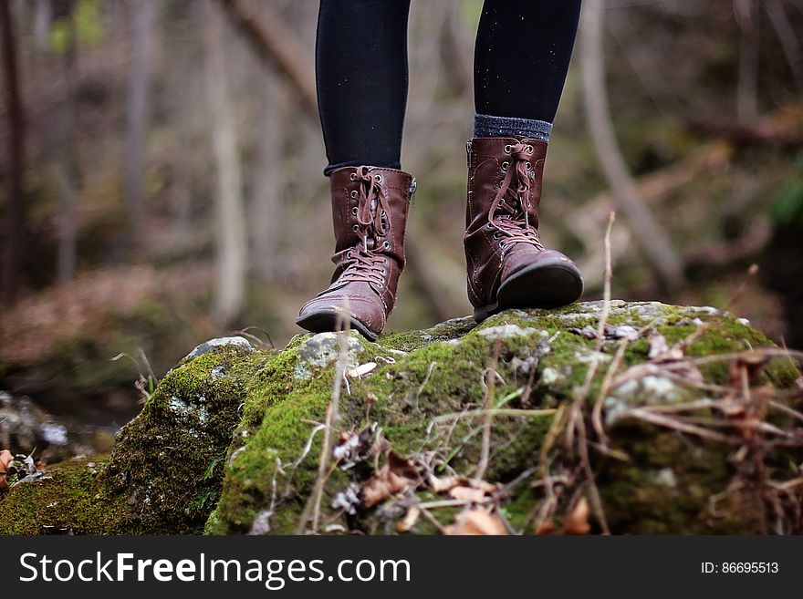 Low Section of Man Standing in Forest