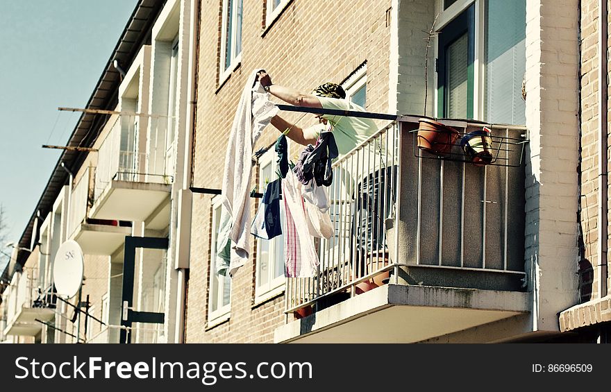 Low Angle View Of Clothes Hanging On Balcony