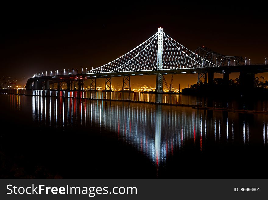 Illuminated Suspension Bridge Against Sky at Night