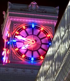 Neon Clock At Night Royalty Free Stock Image
