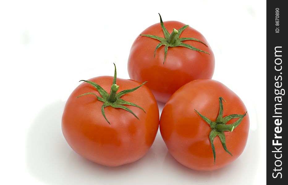 Three tomatoes isolated on the white background
