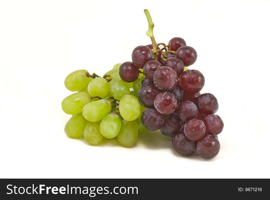 Cluster of red and white grapes isolated on white. Cluster of red and white grapes isolated on white