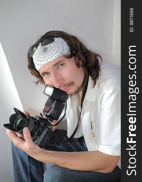 Portrait of the long-haired young moustached man with a kind open sight. Portrait of the long-haired young moustached man with a kind open sight.