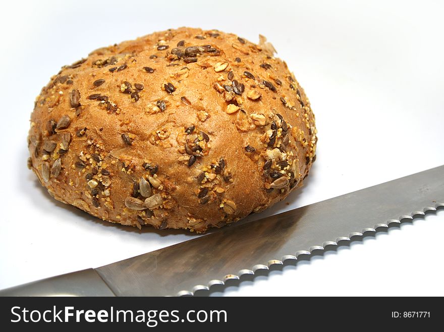 Brown bread with seeds isolated on white background