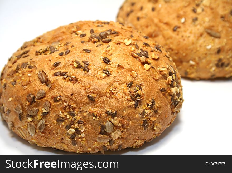 Brown bread with seeds isolated on white background