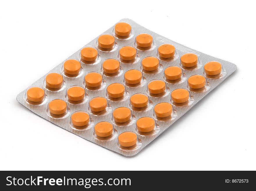 Orange tablets in the blister pack