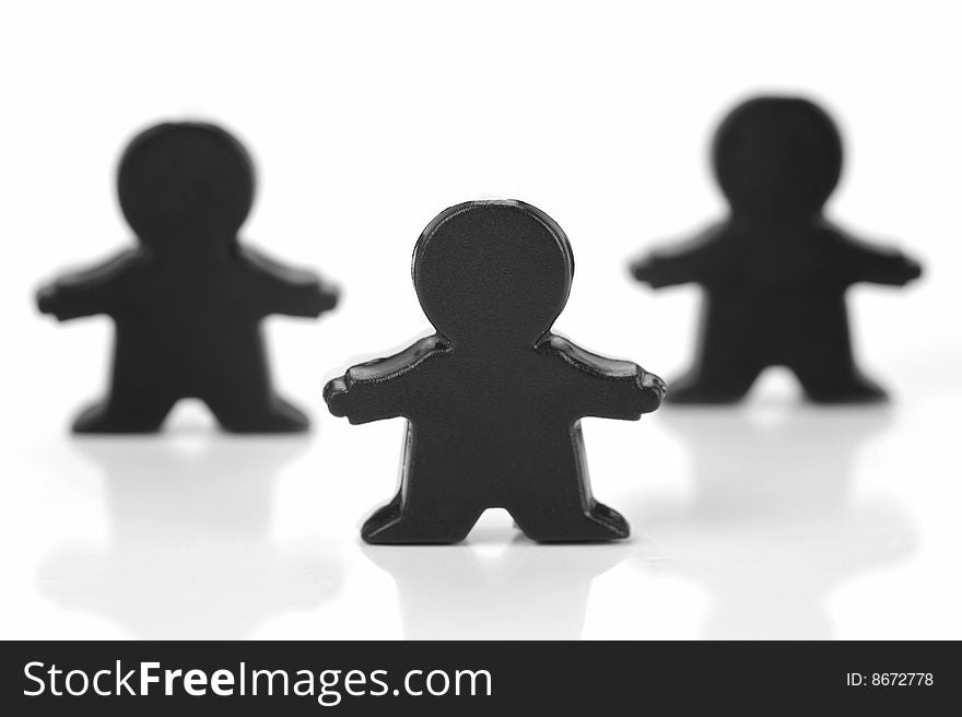 Miniature figurines isolated against a white background