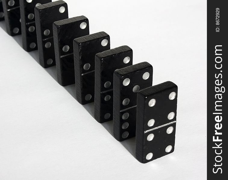 Black playing tesserae dominoes with white background