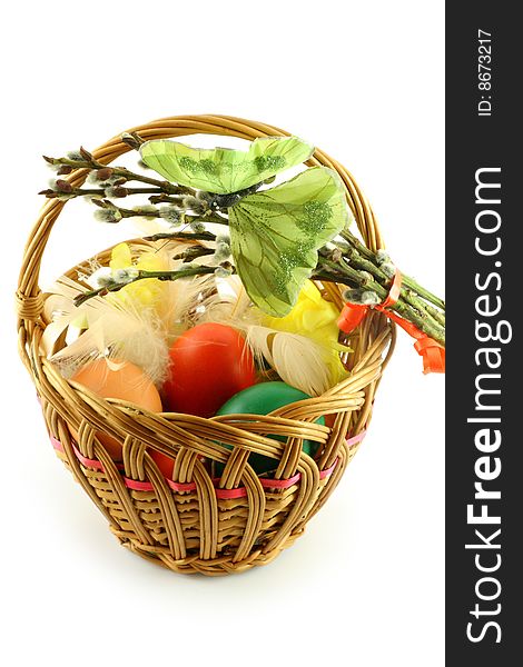 Easter basket, with  colored eggs, over white background. Easter basket, with  colored eggs, over white background