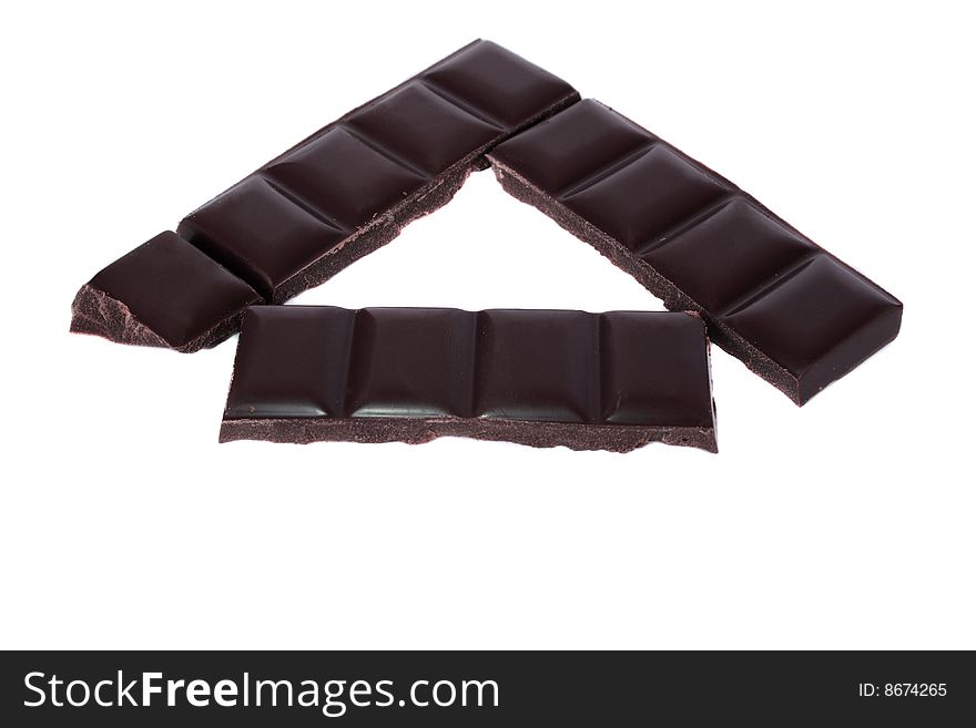 Brown chocolate bars making a arrow isolated on a white background. Brown chocolate bars making a arrow isolated on a white background