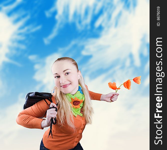 Happy smiling girl with poppies and shoes in hands - against the blue sky. Happy smiling girl with poppies and shoes in hands - against the blue sky