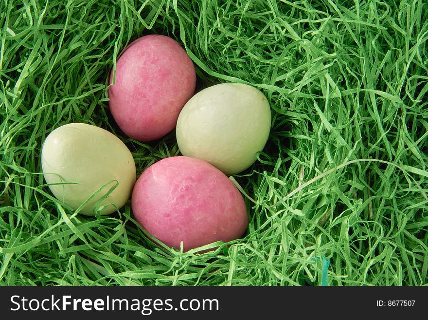 Four Eggs inside a Nest of Grass. Four Eggs inside a Nest of Grass