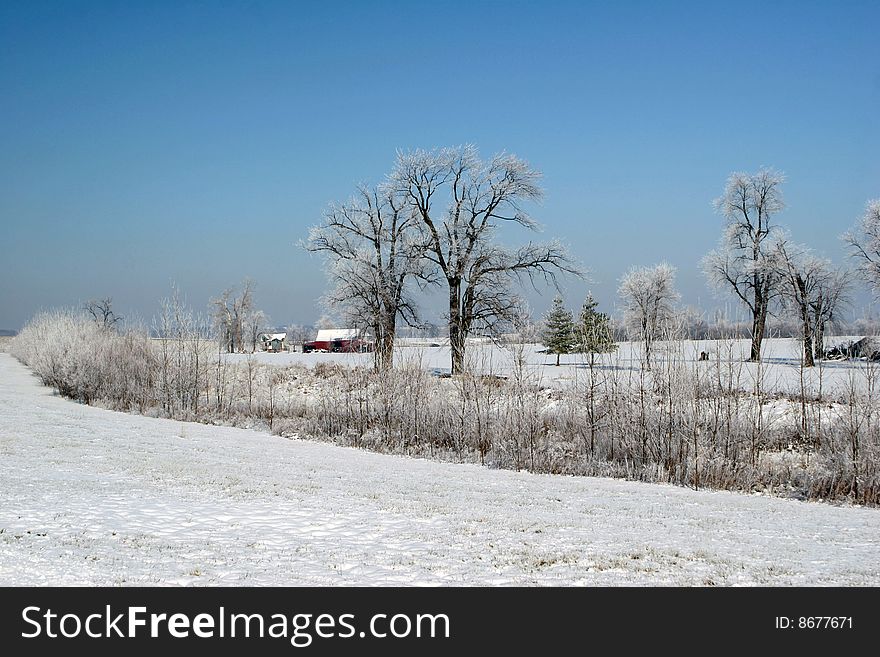 Rural farm in snow and ice setting. Rural farm in snow and ice setting