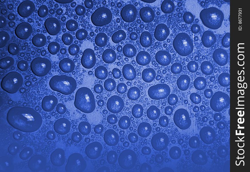 Water drops - blue background texture