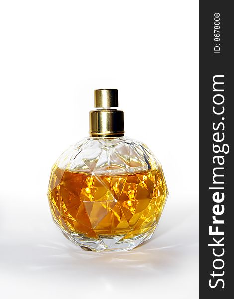 Bottle of perfume, similar to amber, is on a white background