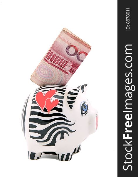 A piggy bank with the hundred RMB on white.