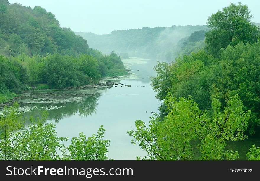 Landscape - meadow, the blue sky and river