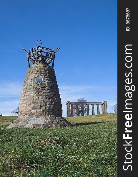 The Democracy Cairn on Edinburgh's Calton Hill with the uncompleted war memorial in the background. The cairn was built in 1998 by the pressure group Democracy for Scotland to commemorate the success of their long campaign for a Scottish Parliament. The Democracy Cairn on Edinburgh's Calton Hill with the uncompleted war memorial in the background. The cairn was built in 1998 by the pressure group Democracy for Scotland to commemorate the success of their long campaign for a Scottish Parliament.