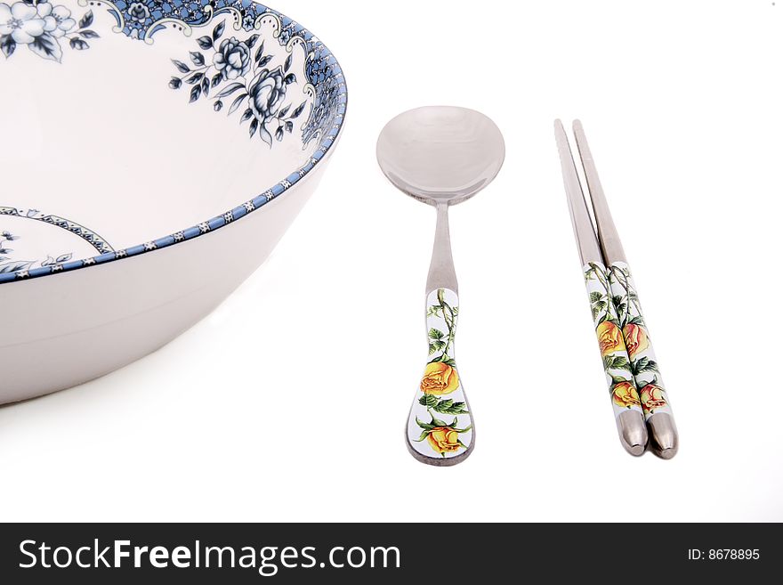 Chinese traditional bowl, spoon and chopsticks on white. Chinese traditional bowl, spoon and chopsticks on white.