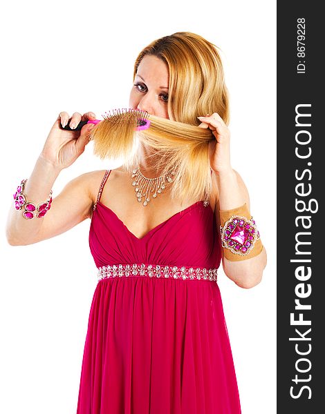Long hair blond woman with hairbrush in her hand. Long hair blond woman with hairbrush in her hand