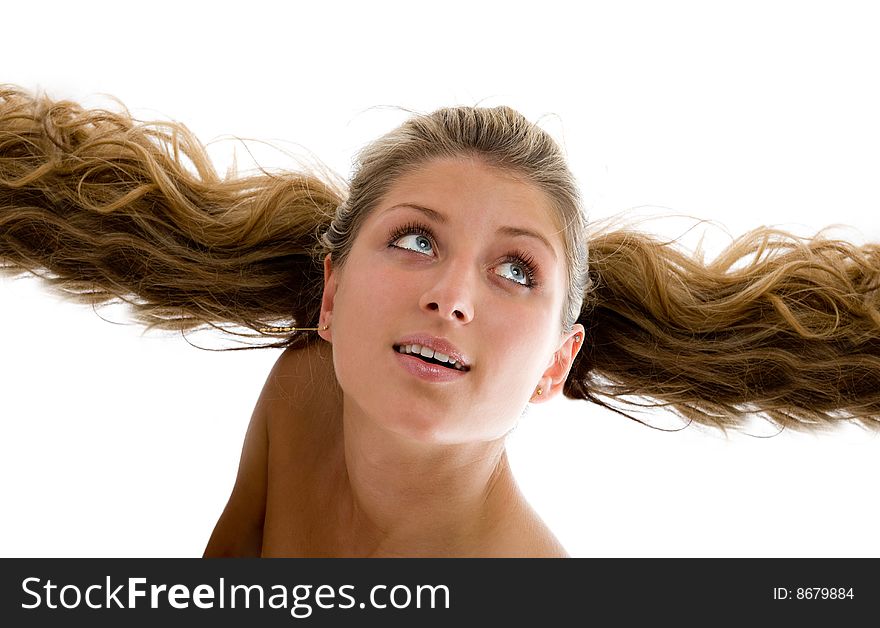 The beautiful girl flies on hair. Isolated over white