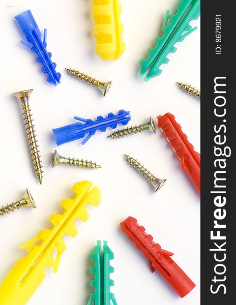 A lot of screws and dowels of various kinds and colours