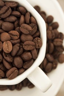 Crop Of Coffee Beans In White Cup And Plate Stock Photo Crop Of Coffee Beans In White Cup And Plate Stock Photo