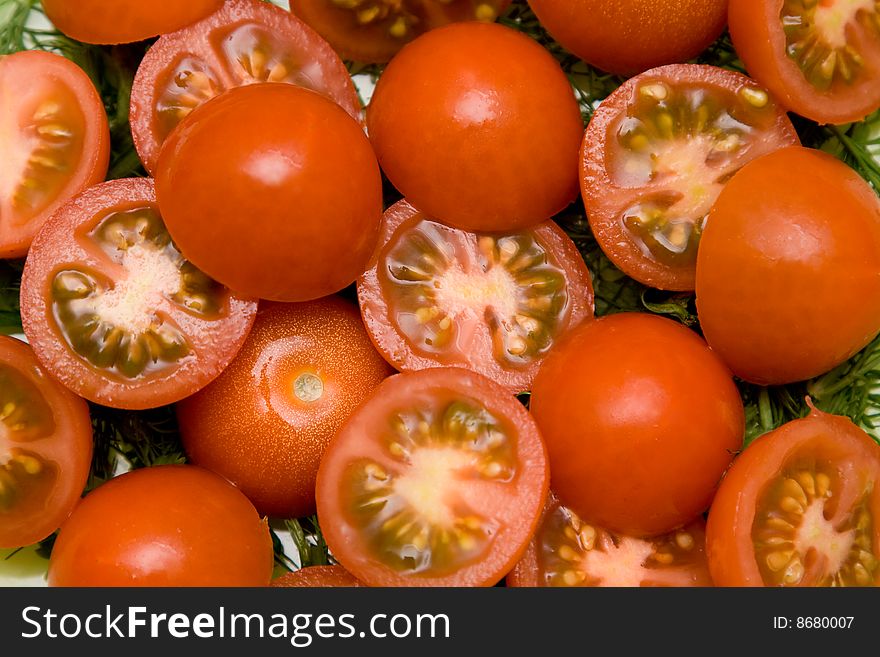 Red tomato and parsley healthy salad on the plate closeup. Red tomato and parsley healthy salad on the plate closeup