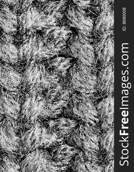 A close-up of the texture of grey woolen fabric. A close-up of the texture of grey woolen fabric