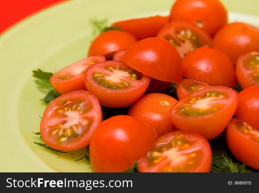 Red tomato and parsley healthy salad on the plate