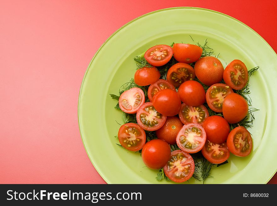 Red tomato and parsley healthy salad on the plate