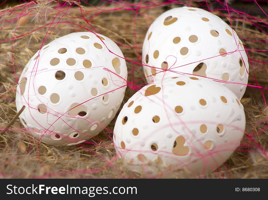 Easter egg spanning in dry grass.