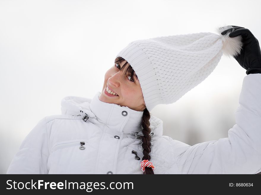 Winter portrait of a happy playful girl - Shallow DOF. Winter portrait of a happy playful girl - Shallow DOF