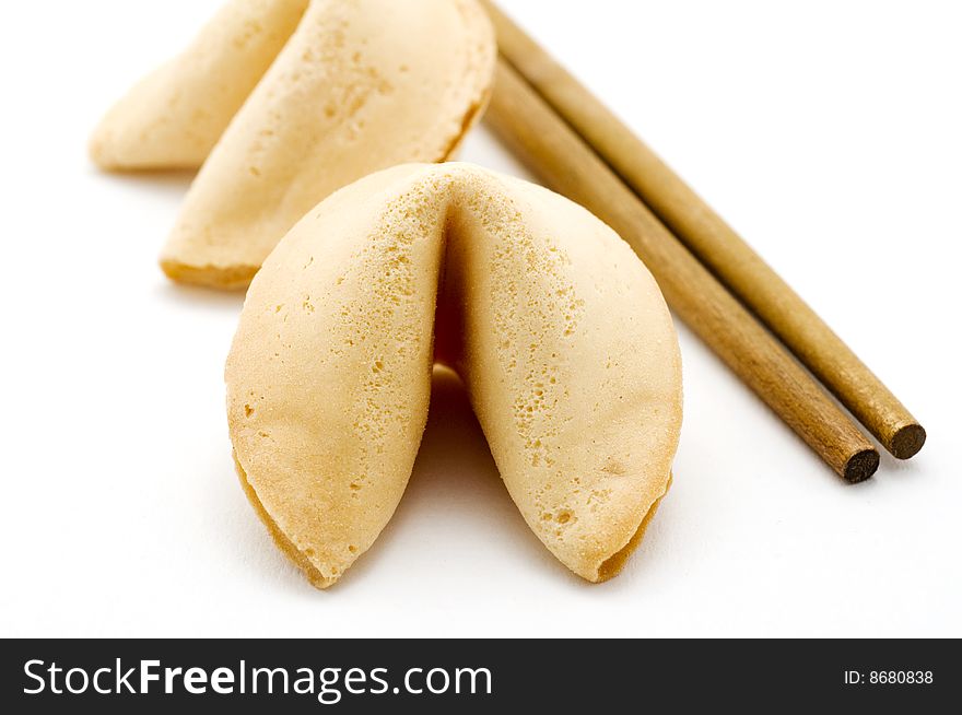 Fortune cookies and wooden chopsticks. Fortune cookies and wooden chopsticks