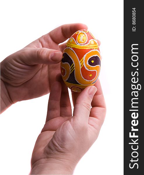 Colorful Easter egg in hands, isolated on white background. Colorful Easter egg in hands, isolated on white background.